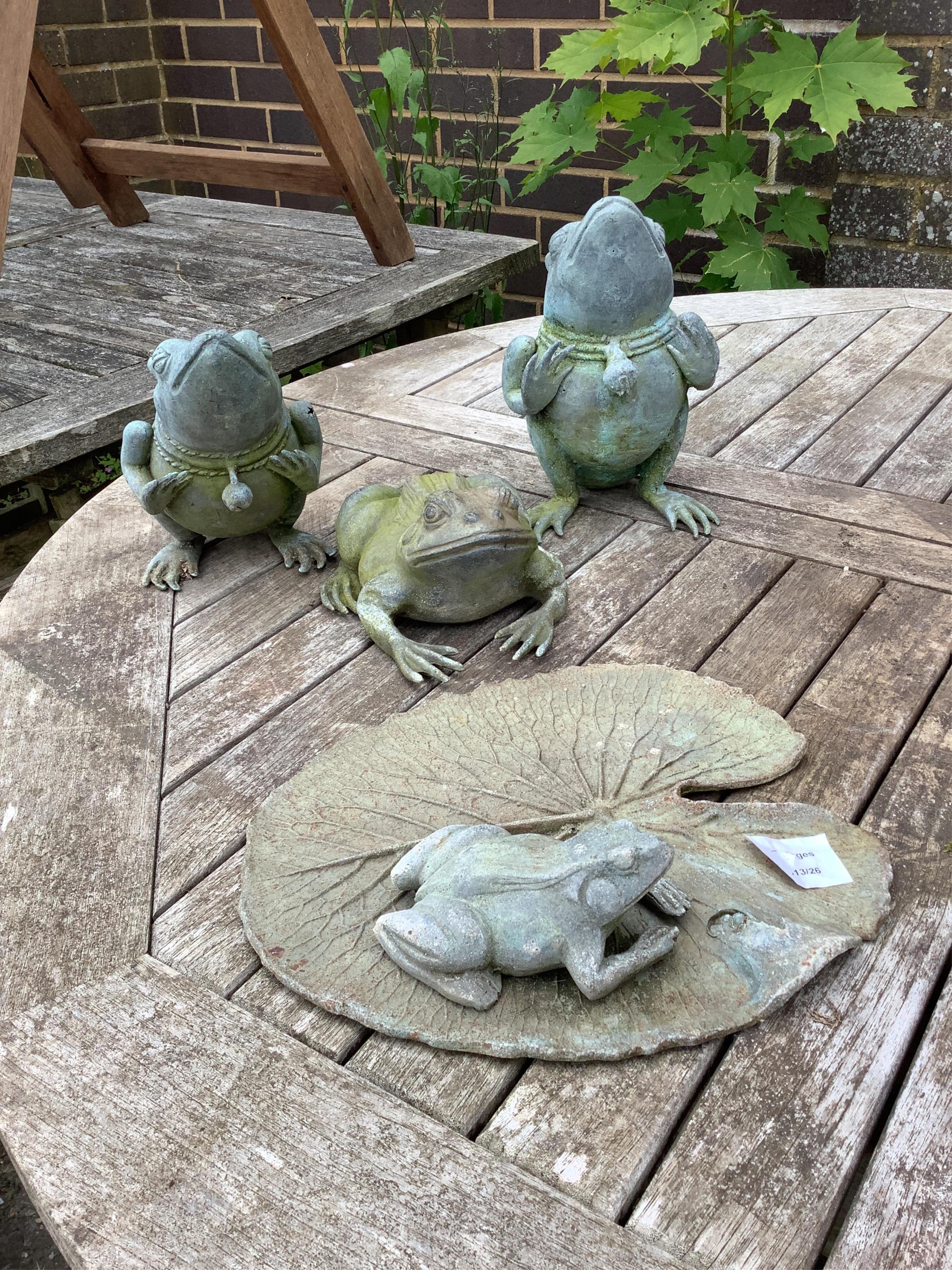 Four metal frog garden ornaments, largest height 22cm. Condition - good
